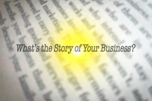 What's the Story of Your Business? An image of typed lettering and a yellow and orange sun flare.  